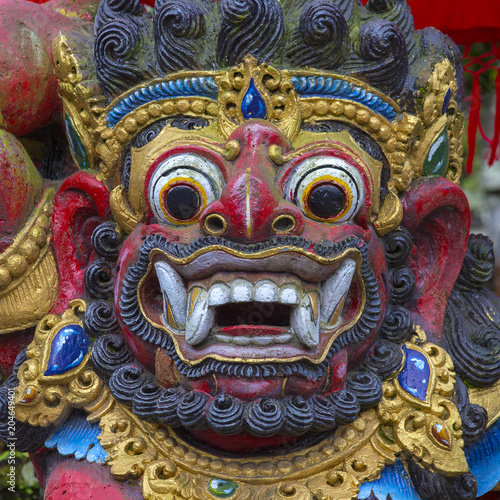 Traditional Balinese statue of Barong on a street temple in Bali, Indonesia