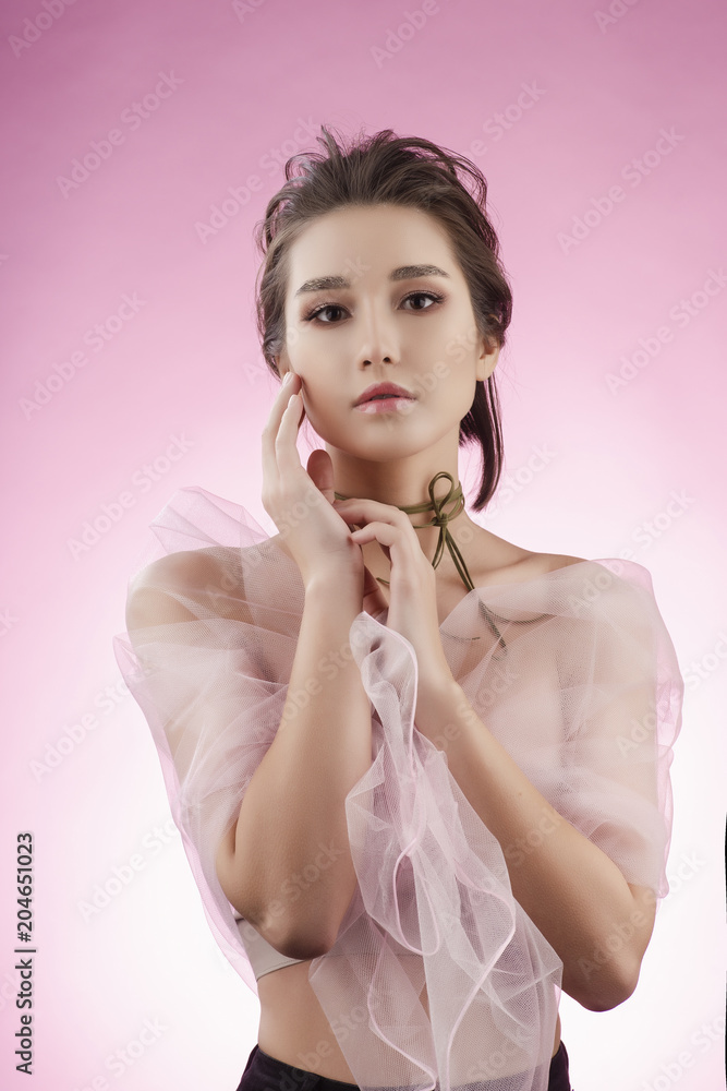 667px x 1000px - Beautiful charming young big breast asian girl wearing a pink veil on her  naked shoulders and a choker on her neck sensually touches her face and  neck Stock Photo | Adobe Stock