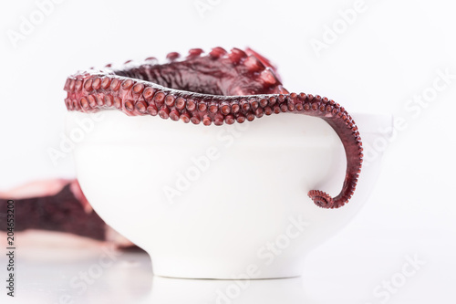 Beautiful octopus tentacle in the white bowl