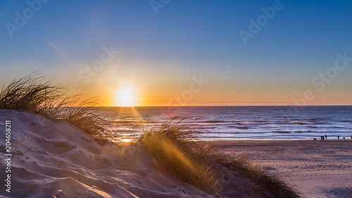 Sunset at the beach of island Texel in the Netherlands © HildaWeges