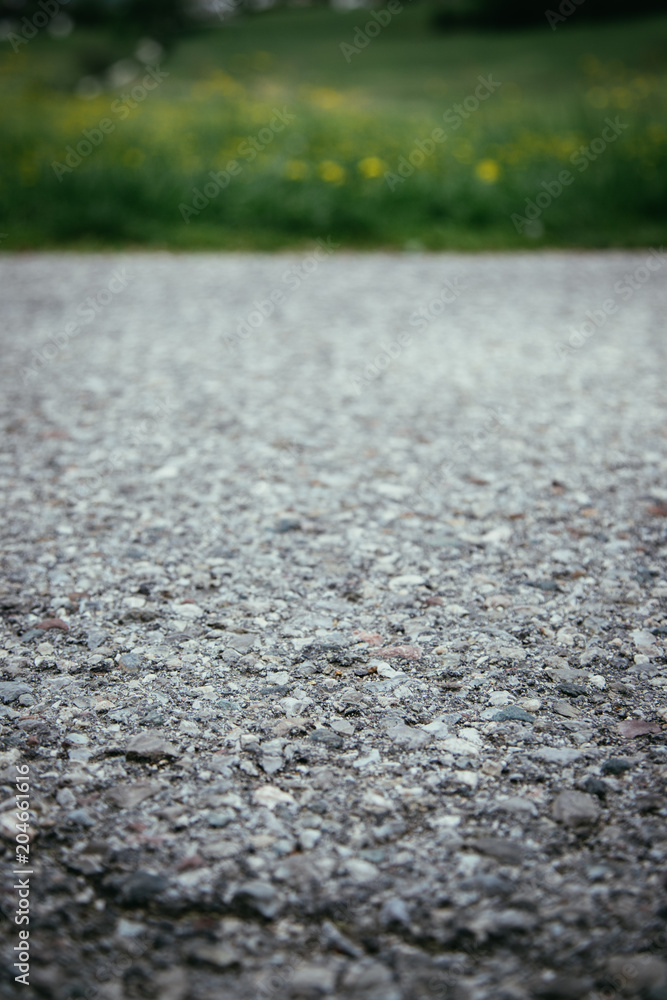 Nahaufnahme Asphalt, unscharfer Hintergrund Nahaufnahme Asphalt, unscharfer Hintergrund