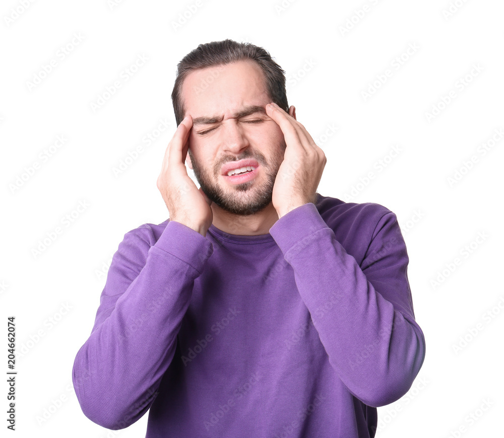 Young man suffering from headache on white background Young man suffering from headache on white background