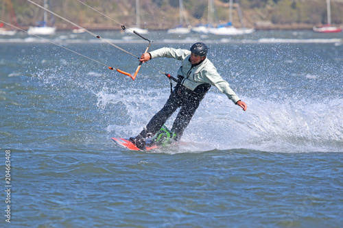 kitesurfer riding toeside in Portland harbour
