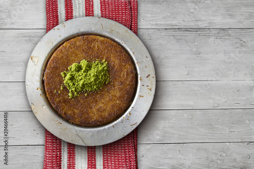 Photography Kanafeh Middle Eastern cheese pastry over table top view