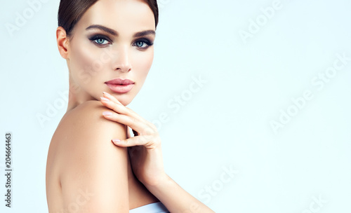 Beautiful young woman with clean fresh skin .Girl beauty face care. Facial treatment .   