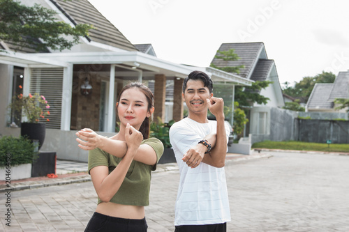 happy young asian people exercise and warm up