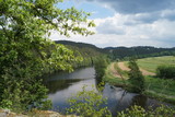 panorama to the fields of the river and wooded mountains