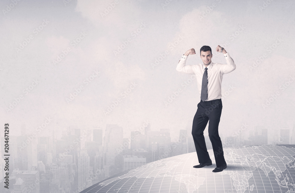 A happy, well dressed construction manager drawing with a pen and planning while standing on top of the earth concept. A happy, well dressed construction manager drawing with a pen and planning while standing on top of the earth concept.
