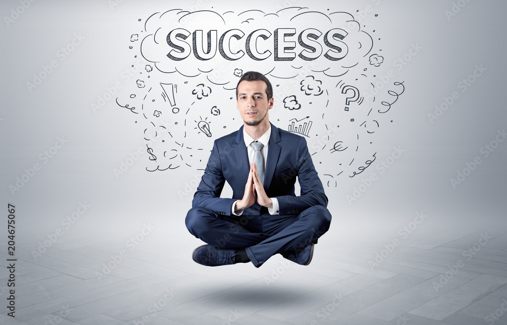 Businessman sitting in yoga position and meditates with doodle concept
Businessman sitting in yoga position and meditates with doodle concept