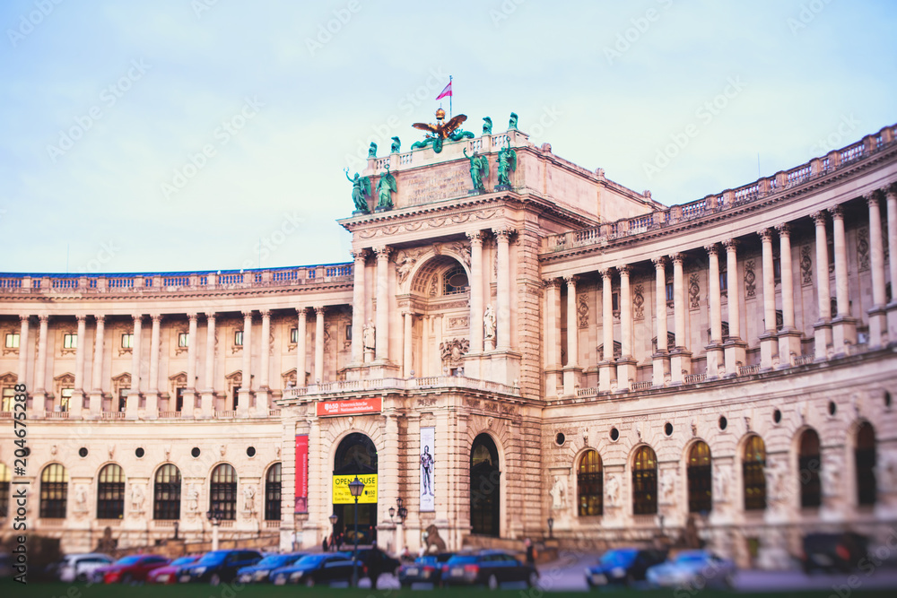 View of Austrian Library building facade exterior, established in 18th century, Hofburg Palace, Vienna, Austria, summer sunny day
