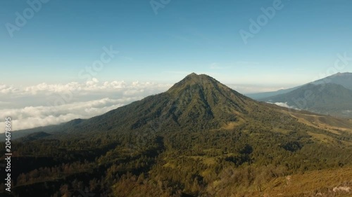 Wallpaper Mural Mountain landscape, clouds, relief. Aerial view of Green tropical mountain cover with cloud Banyuwangi Regency of East Java, Indonesia. 4K Aerial footage. Torontodigital.ca