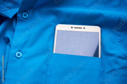 phone in a blue shirt pocket