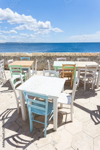 Gallipoli, Apulia - Out for lunch in the sun at the middle aged promenade © tagstiles.com