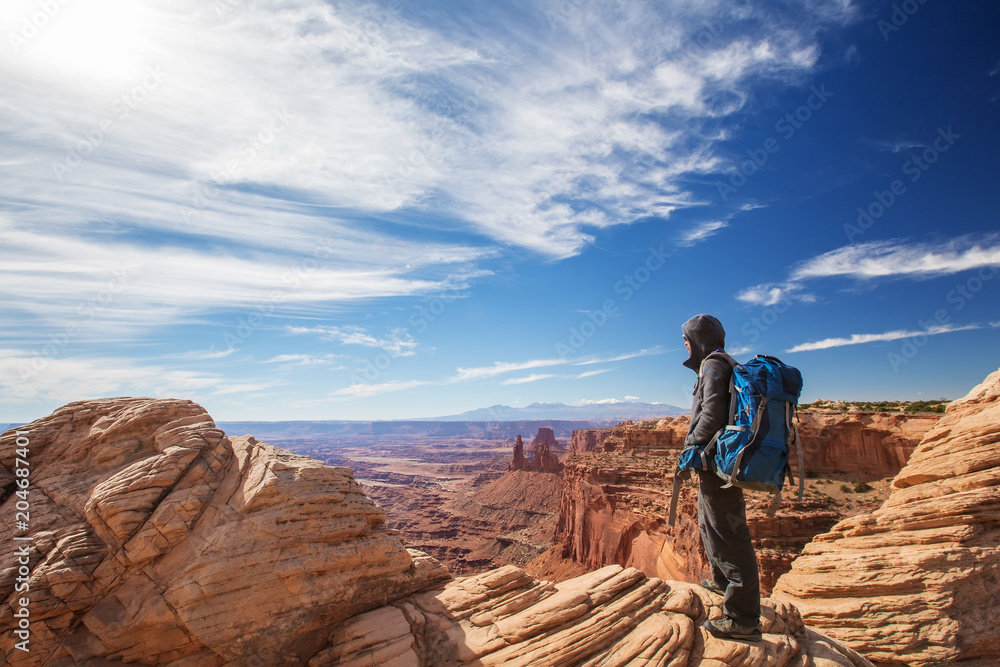 Fototapeta premium Hiker in Canyonlands National park in Utah, USA