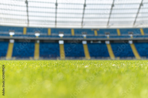 Grass and tribune at a football stadium photo