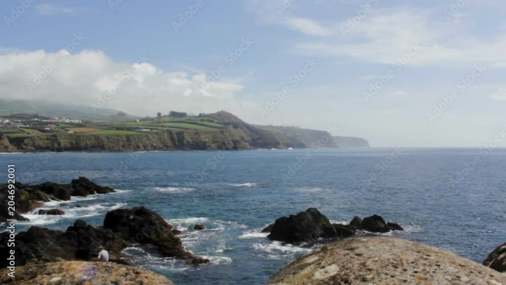 Coastline landscape with Blue Ocean and land with green fields Coastline landscape with Blue Ocean and land with green fields