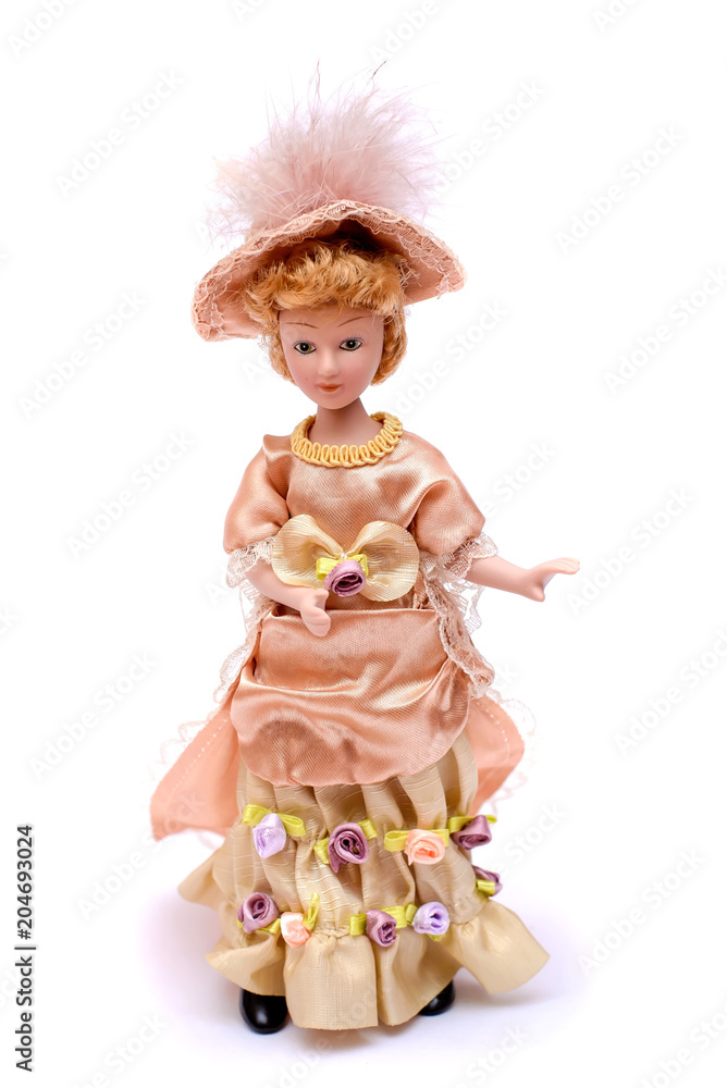 Fototapeta premium Porcelain doll in vintage dress and hat