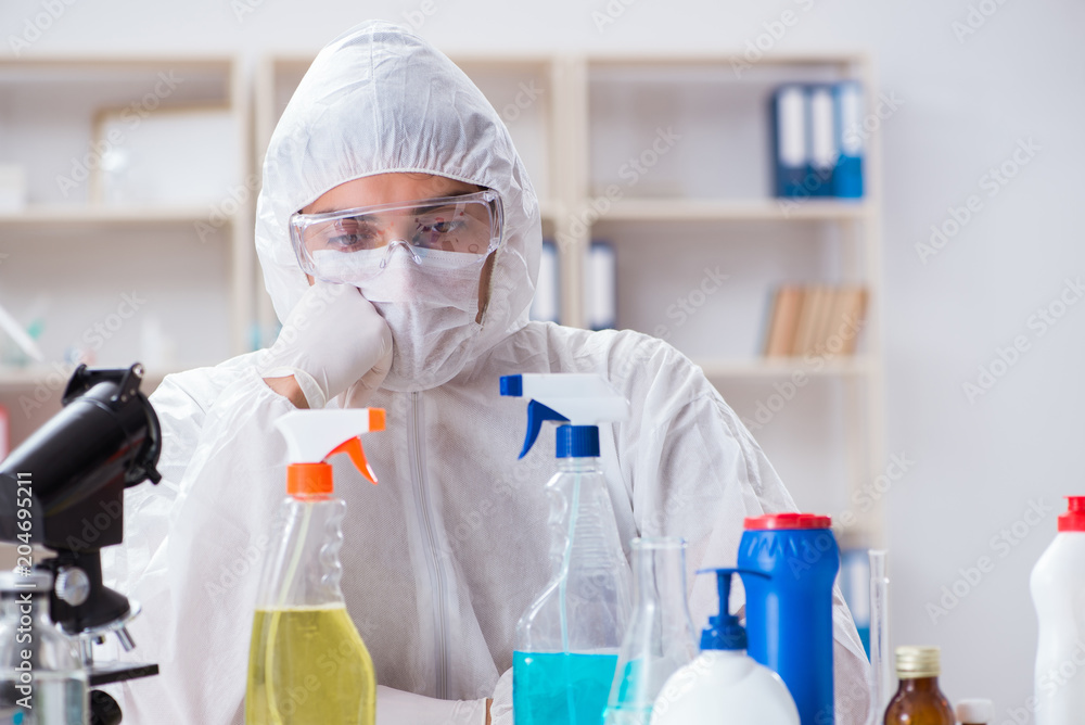 Chemist checking the quality of bathroom supplies Chemist checking the quality of bathroom supplies