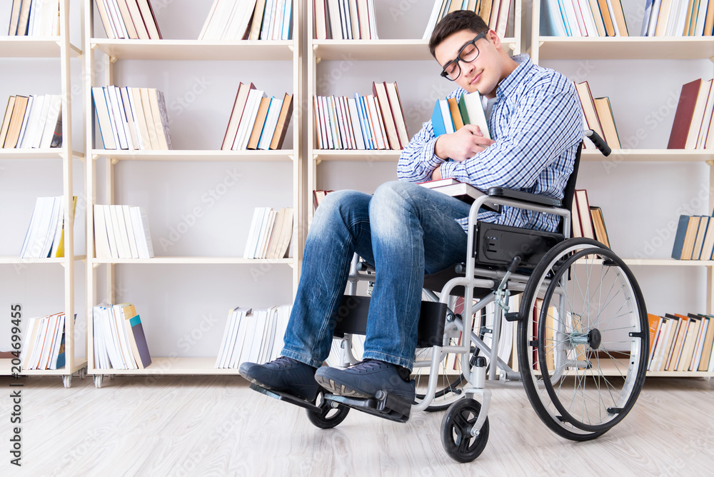 Disabled student studying in the library Disabled student studying in the library