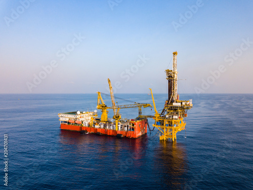 Aerial View of Tender Drilling Oil Rig (Barge Oil Rig) in The Middle of The Ocean