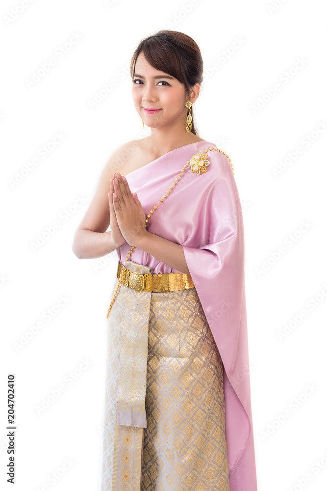 Women stand wearing traditional cloth Thailand or Thai dress isolate on white background. Sawasdee greet or welcome Women stand wearing traditional cloth Thailand or Thai dress isolate on white background. Sawasdee greet or welcome