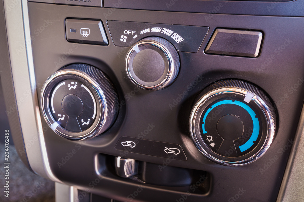 Detail of the air conditioning button control inside a car. Detail of the air conditioning button control inside a car.