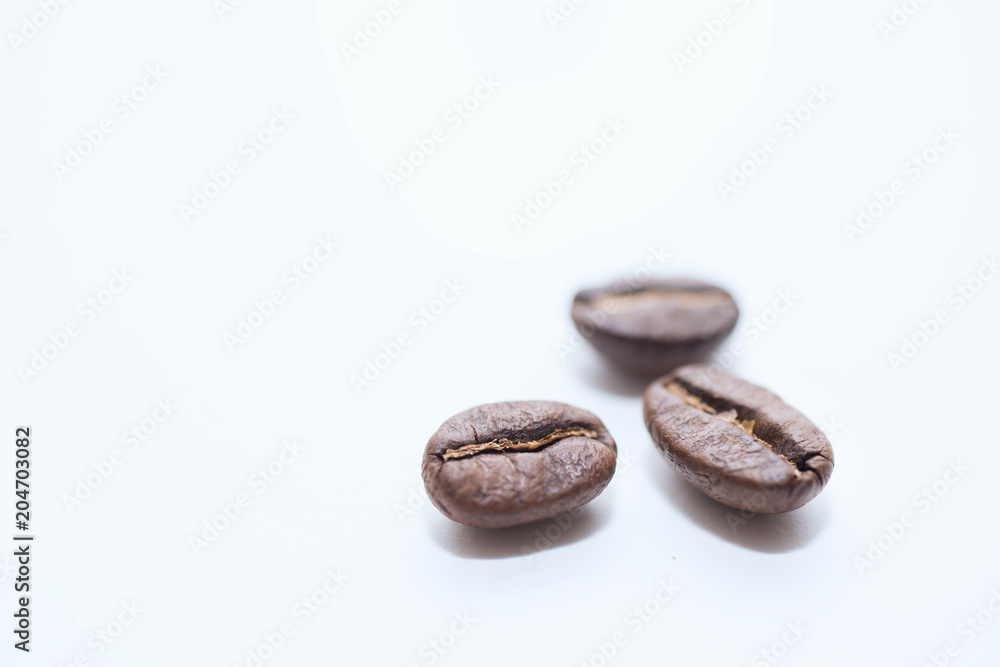 Roasted coffee beans on white background Roasted coffee beans on white background