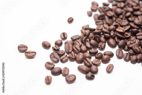 Roasted coffee beans on white background