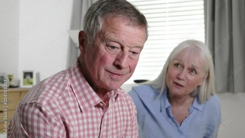 Mature Woman Comforting Man With Depression At Home Mature Woman Comforting Man With Depression At Home