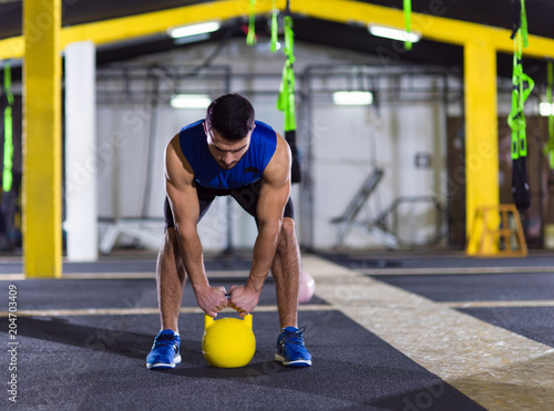 man exercise with fitness kettlebell