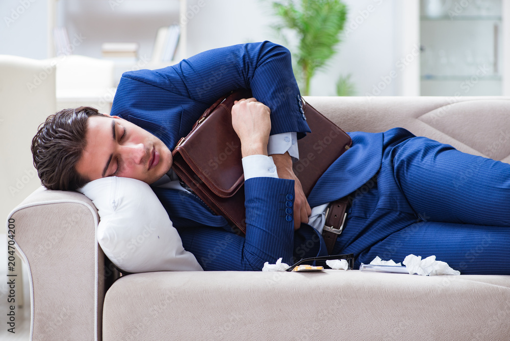 Obraz premium Sick employee staying at home suffering from flue