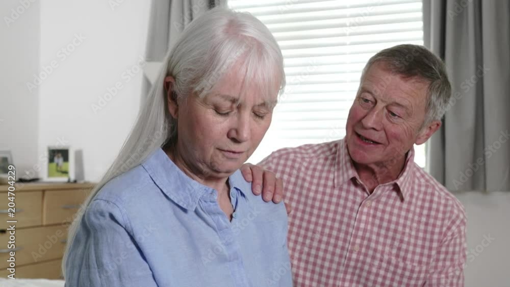 Mature Man Comforting Woman With Depression At Home Mature Man Comforting Woman With Depression At Home