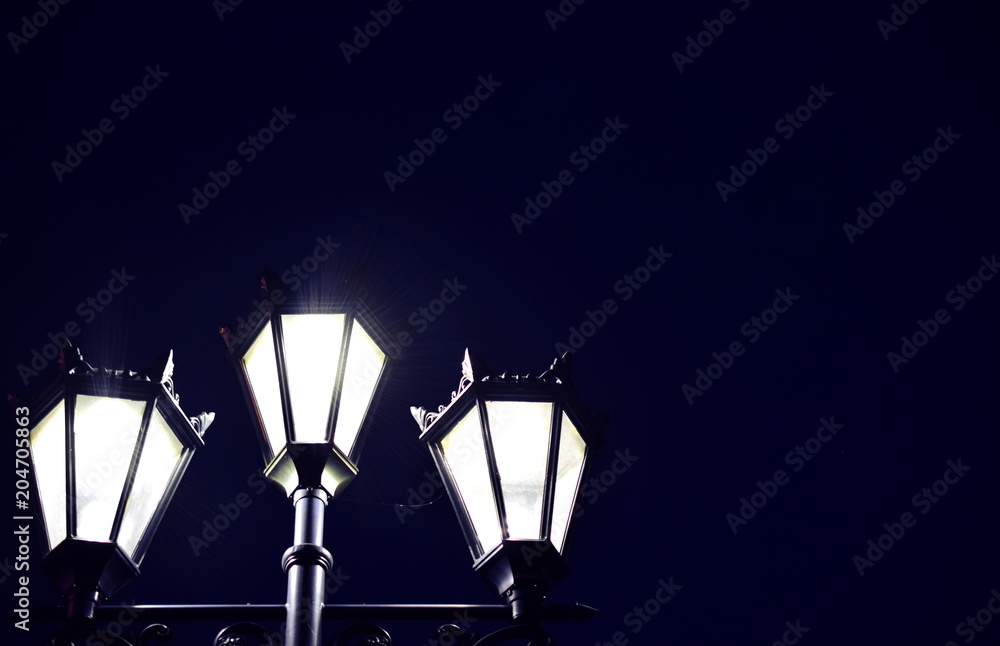 Cylindrical lamps in the night. Closeup. Copy space. Cylindrical lamps in the night. Closeup. Copy space.