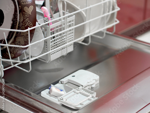 placing the dishwasher detergent for dirty dishes
