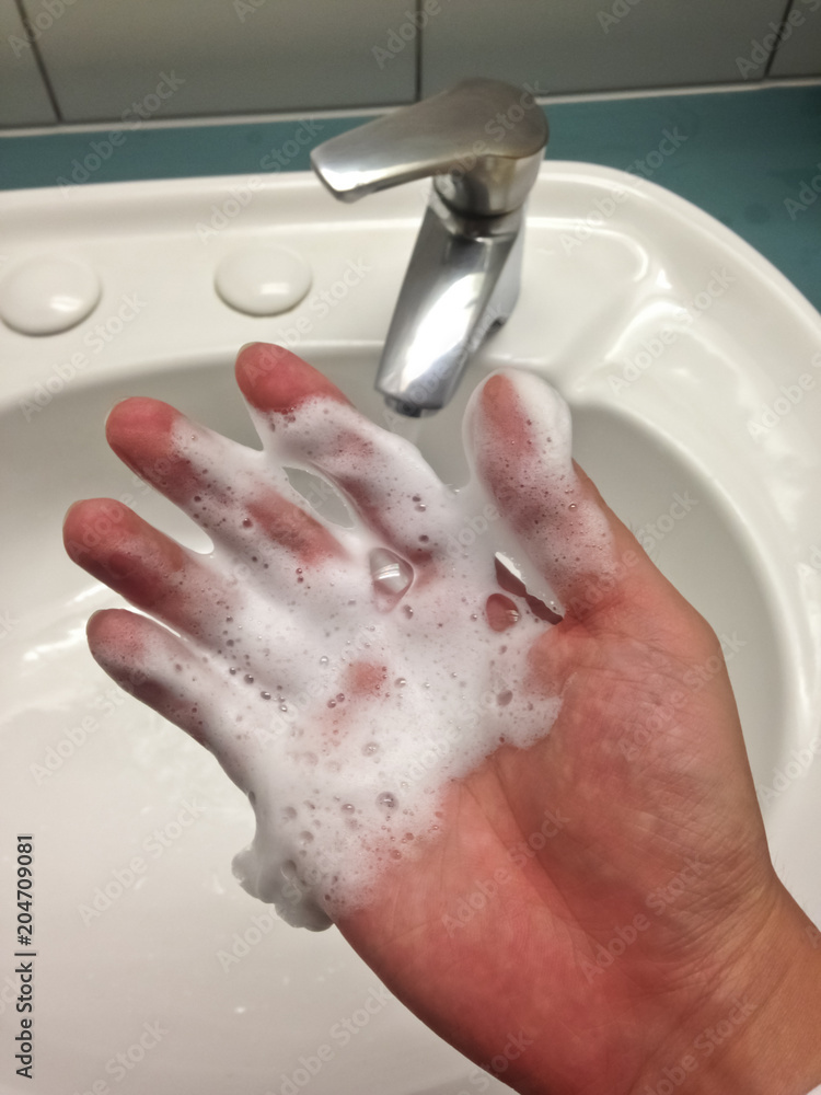 Fototapeta premium Hand washing soap with sink