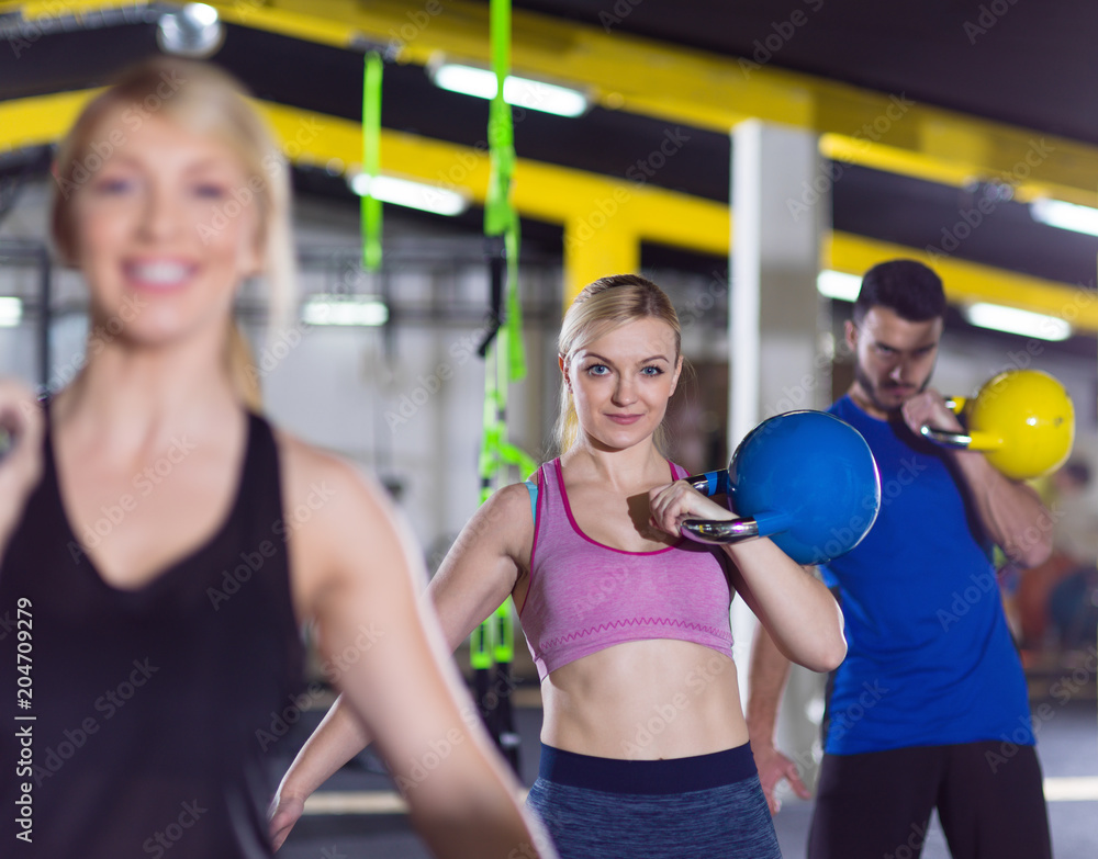 athletes doing exercises with kettlebells athletes doing exercises with kettlebells