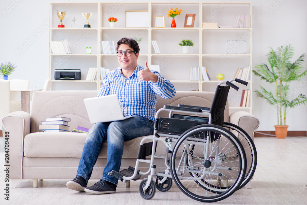 Young student on wheelchair in disability concept Young student on wheelchair in disability concept