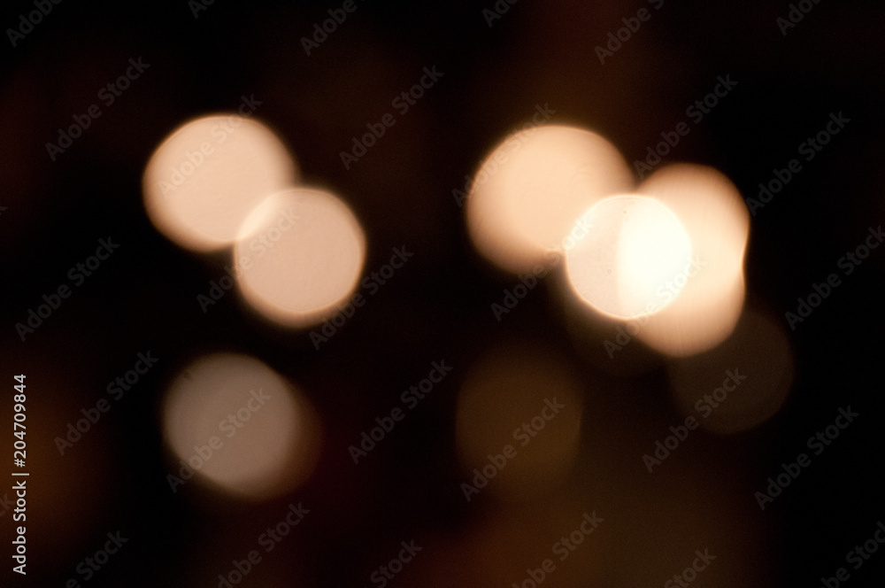 Defocused yellow festive bokeh background Defocused yellow festive bokeh background