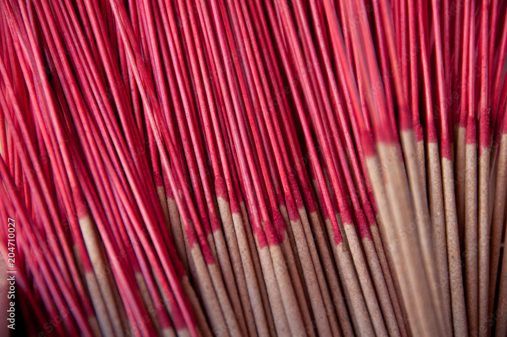 Fototapeta premium Red classical Asian incense sticks in pair