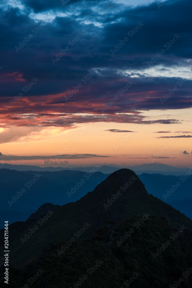 Sunset on peak of mountain with sky clod before rainy Sunset on peak of mountain with sky clod before rainy