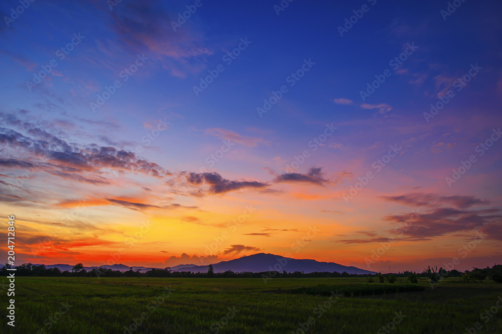 landscape of mountain and field in countryside at twilight landscape of mountain and field in countryside at twilight