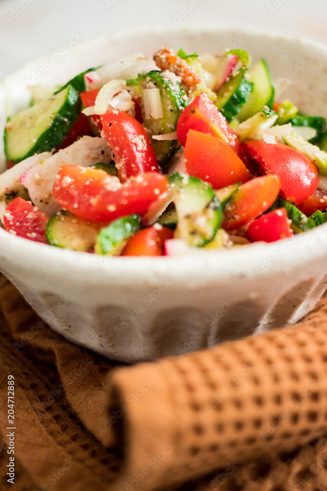 Fresh vegetables Greek salad with tomatoes, cucumbers, onion slices and sprouts. Served with olive oil. Raw vegan vegetarian healthy food on lunch or dinner Fresh vegetables Greek salad with tomatoes, cucumbers, onion slices and sprouts. Served with olive oil. Raw vegan vegetarian healthy food on lunch or dinner