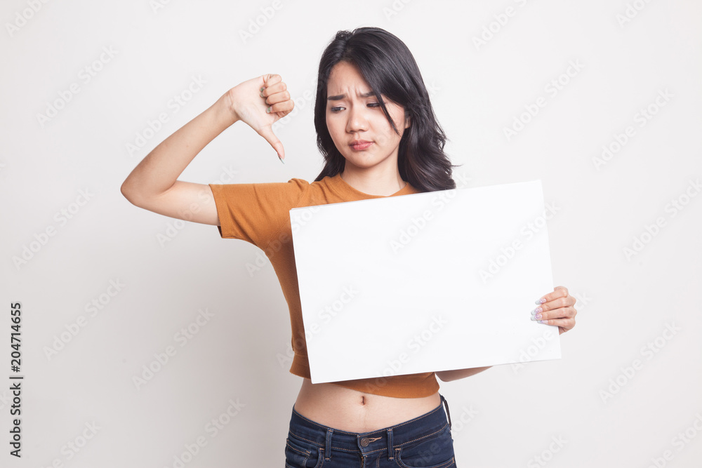 Young Asian woman show thumbs down with white blank sign. Young Asian woman show thumbs down with white blank sign.
