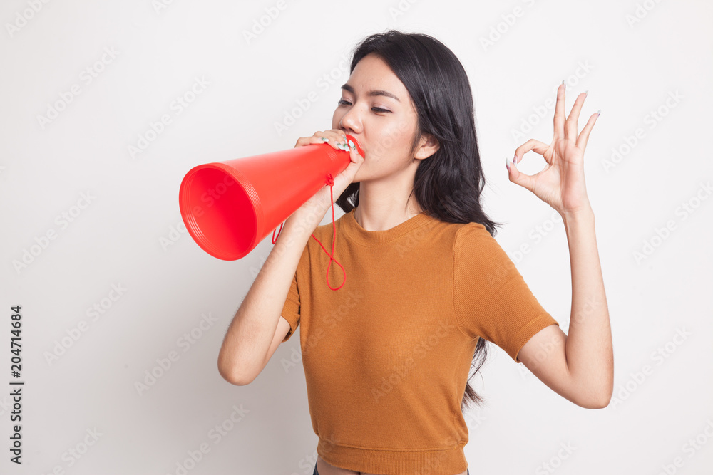 Beautiful young Asian woman show OK announce with megaphone. Beautiful young Asian woman show OK announce with megaphone.