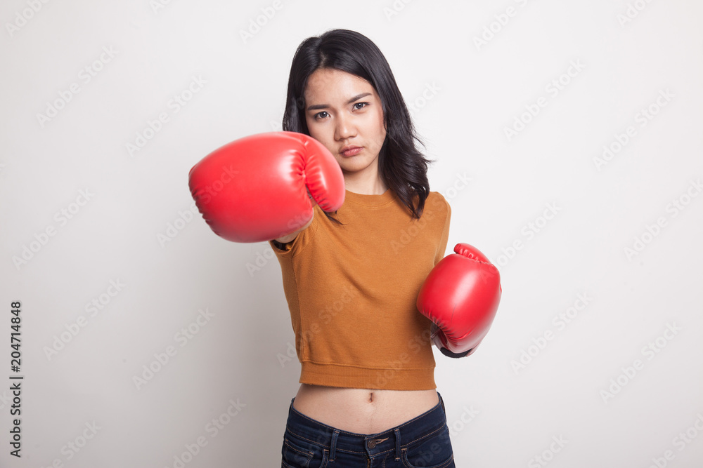 Young Asian woman with red boxing gloves. Young Asian woman with red boxing gloves.