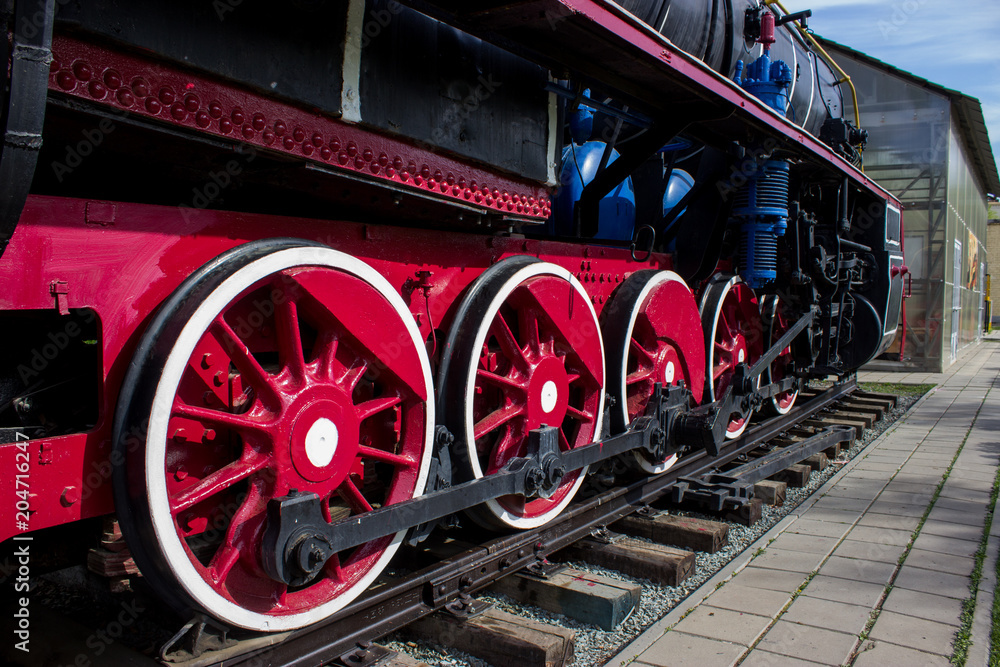 Wheels of red color of the old locomotive Wheels of red color of the old locomotive