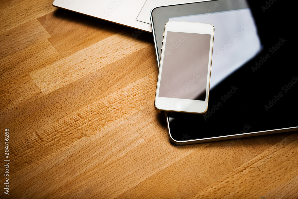 keyboard with phone and tablet pc on wooden desk keyboard with phone and tablet pc on wooden desk