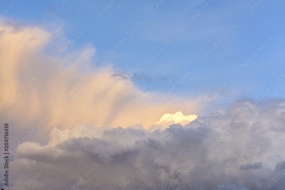 Cumulus clouds in the evening sunset sky. Cumulus clouds in the evening sunset sky.