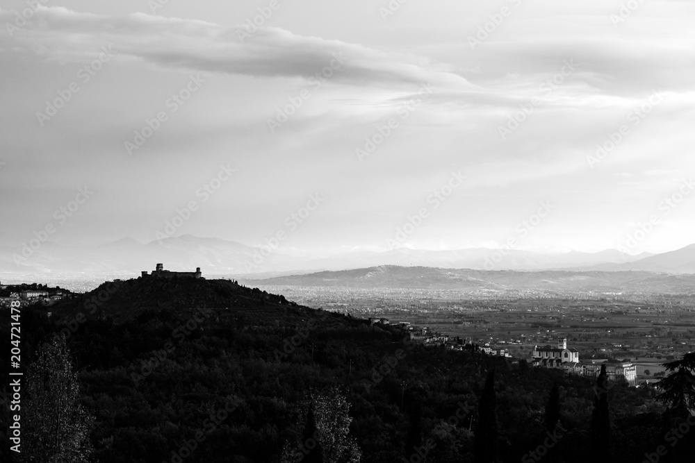 View of Assisi town from behind, with St. Francis church and Rocca Maggiore