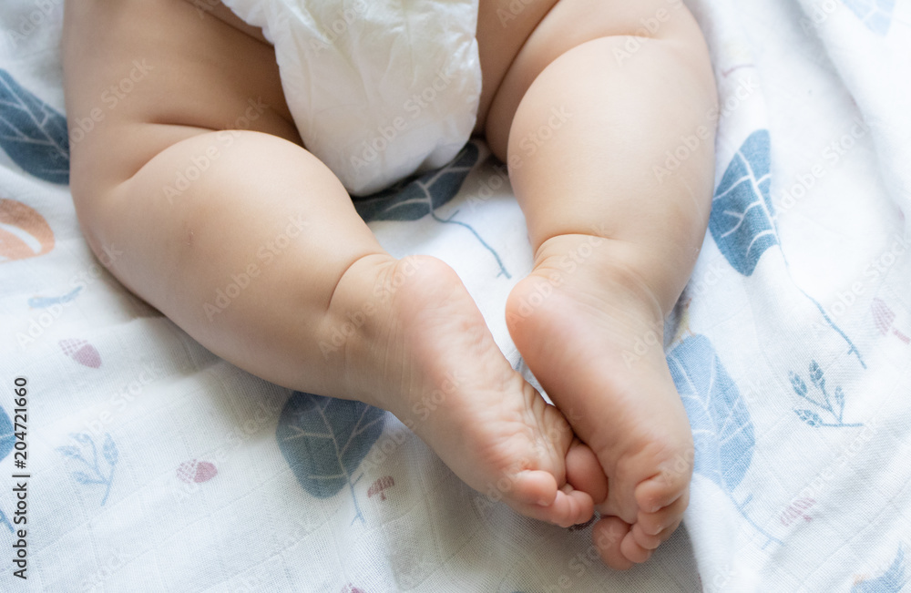 Baby hands in mother hands. Mom and her Child.Happy Family concept Baby hands in mother hands. Mom and her Child.Happy Family concept